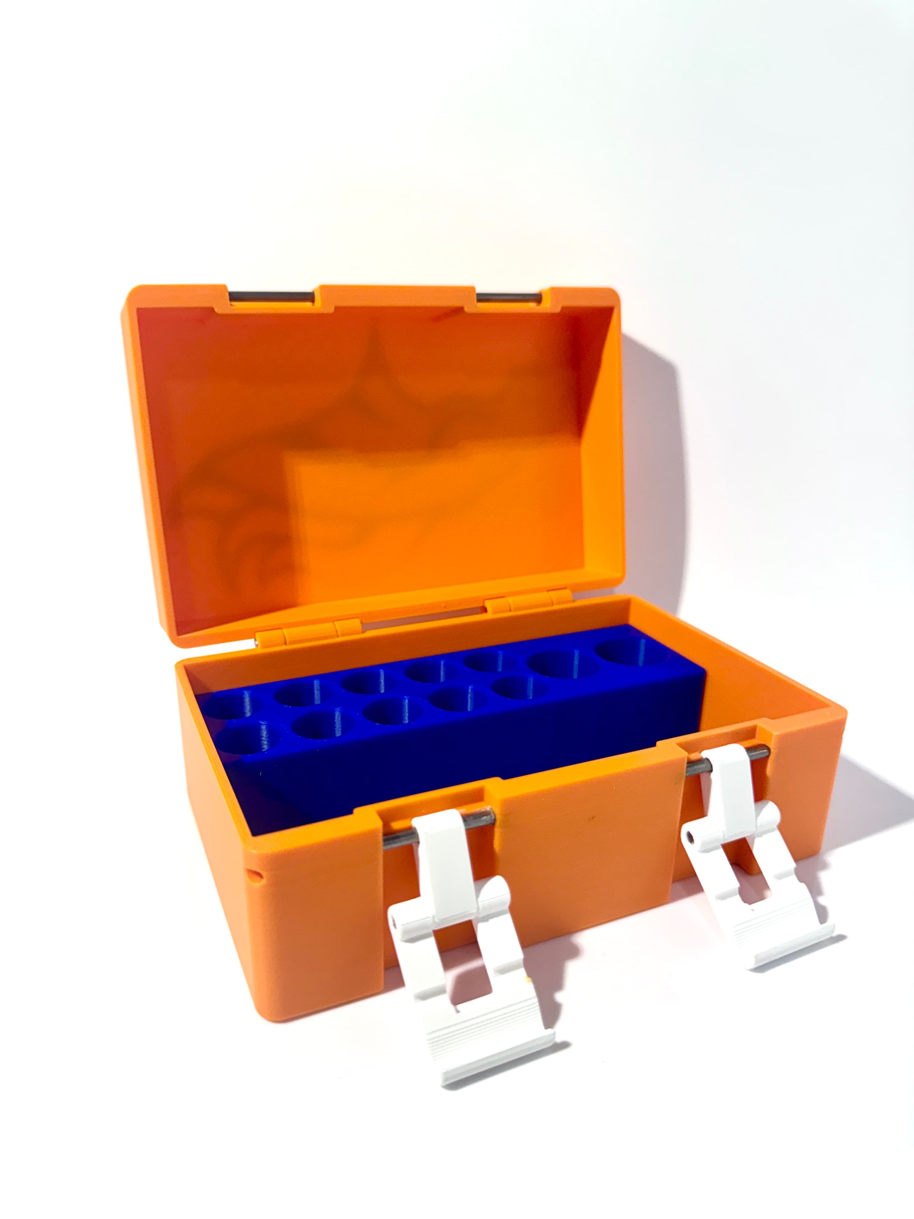 Bright orange vial box open with blue precision vial inserts