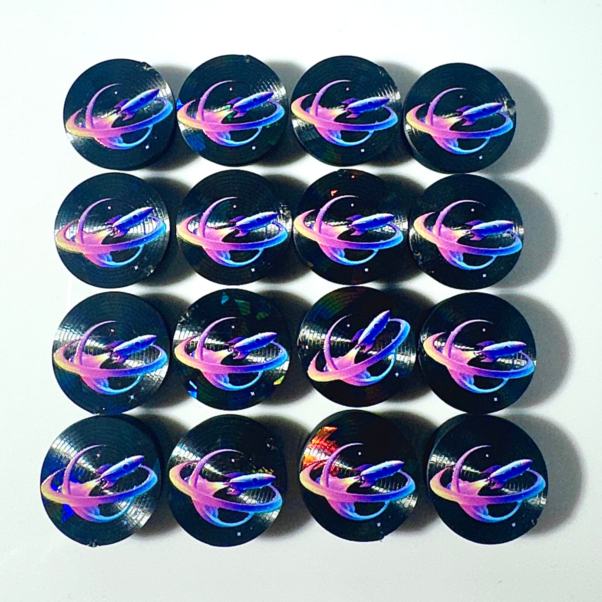 Black caps with holographic galaxy logo prints