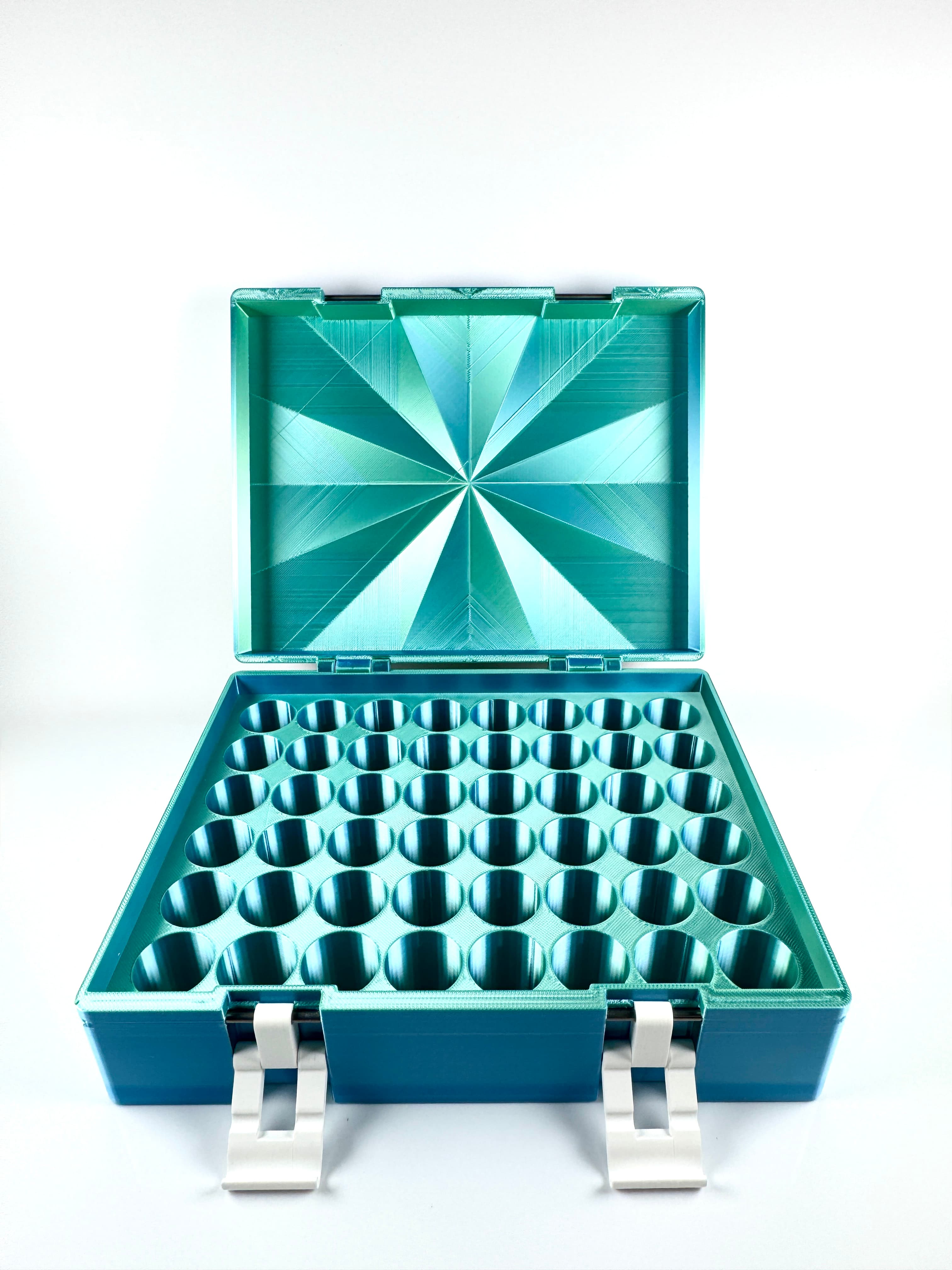 Large teal vial box fully open, showing precision 36-vial honeycomb grid interior